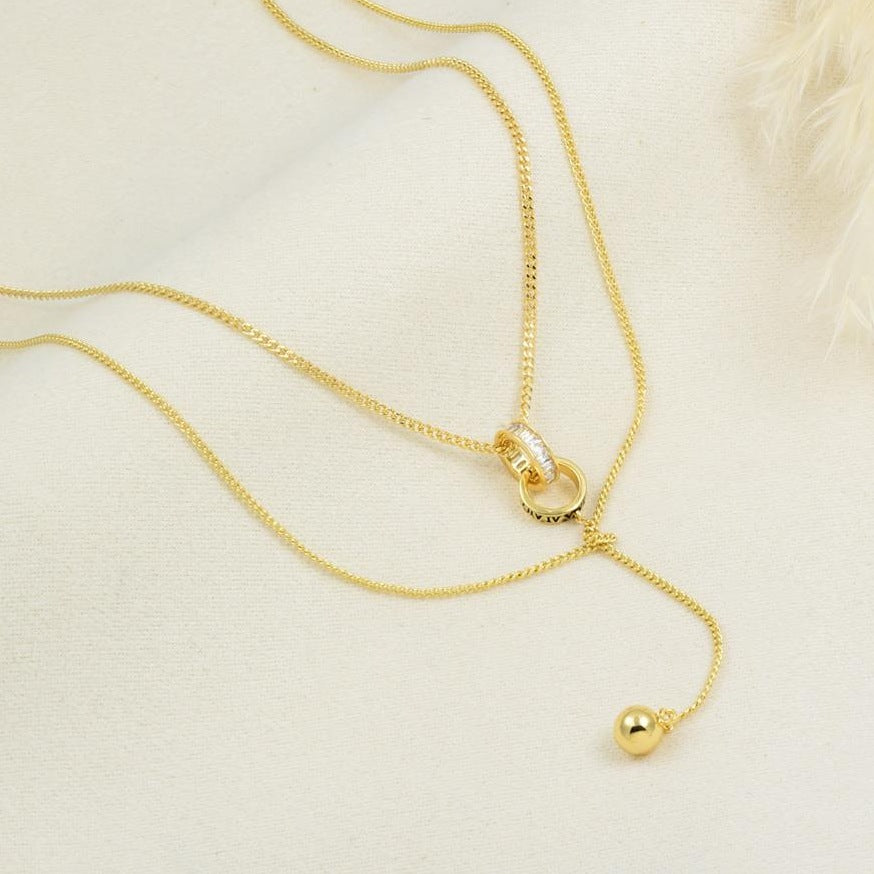 Collar lariat con caída en Y en baño de rodio dorado | Feral