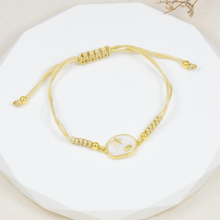 Pulsera de cordón ajustable con medallón de nácar en baño de rodio dorado | Feral
